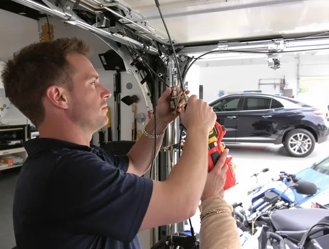 Town 'n' Country Garage Door Repair safety certified technician performing cable replacement in Town 'n' Country