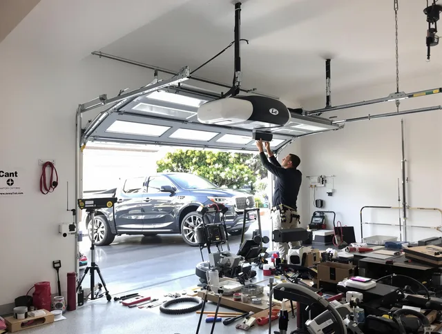 Town 'n' Country Garage Door Repair specialist installing smart garage door opener system in Town 'n' Country home