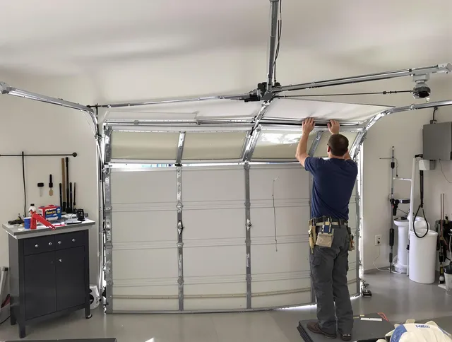 Town 'n' Country Garage Door Repair specialist performing precise section replacement on Town 'n' Country garage door