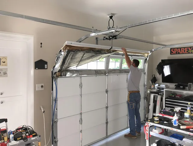 Garage door section replacement by Town 'n' Country Garage Door Repair in Town 'n' Country
