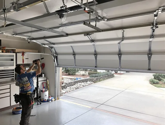 Garage door track repair service by Town 'n' Country Garage Door Repair in Town 'n' Country